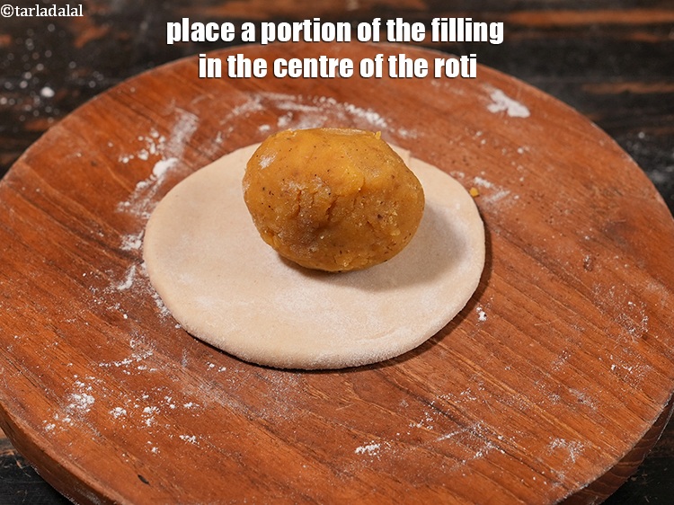 Step 32 – Place a portion of the filling in the centre of the roti.