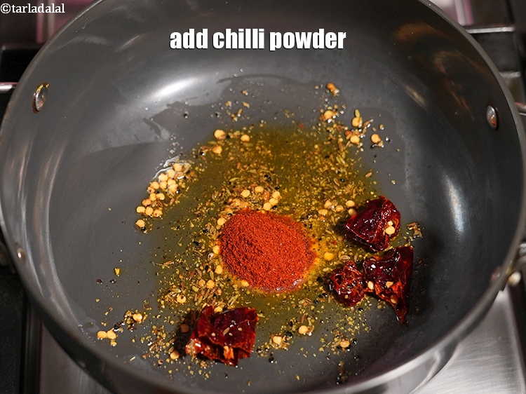 Step 32 – Add &frac12; tsp <a href="https://www.tarladalal.com/glossary-chilli-powder-red-chilli-powder-339i">chilli powder</a>.