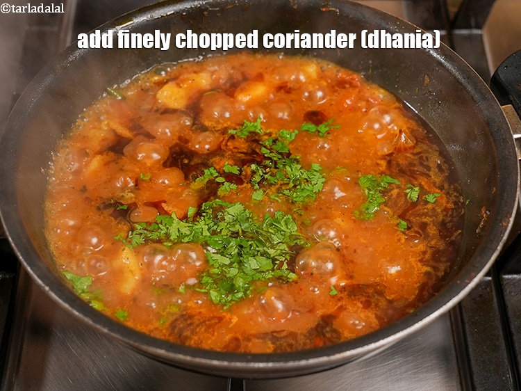 Step 32 – Add&nbsp;2 tbsp&nbsp;finely&nbsp;<a href="https://www.tarladalal.com/glossary-chopped-coriander-783i">chopped coriander (dhania)</a>.