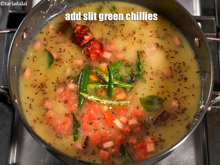 Step 32 – Add 4 slit green chillies.&nbsp;