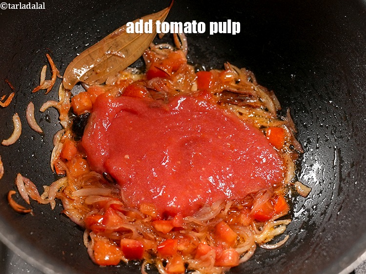Step 33 – Add &frac12; cup <a href="https://www.tarladalal.com/glossary-tomato-pulp-tamatar-ka-pulp-1039i">tomato pulp</a>.