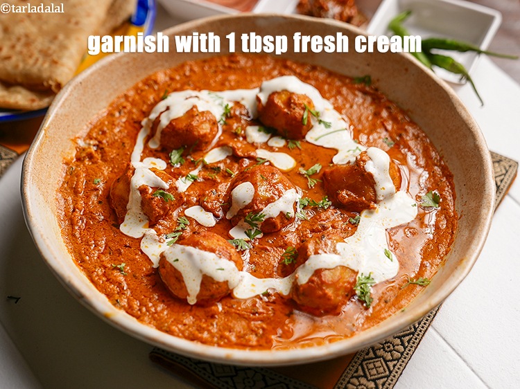 Step 33 – Garnish with 1 tbsp <a href="https://www.tarladalal.com/glossary-fresh-cream-1877i">fresh cream</a>.