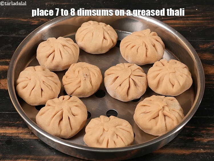 Step 33 – Place 7 to 8 dimsums on a greased thali.