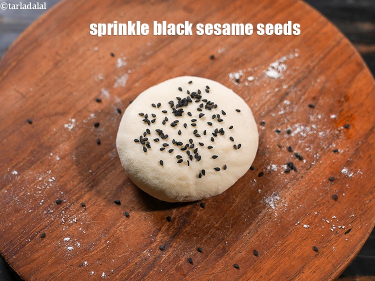 Step 33 – Sprinkle &frac12; tsp&nbsp;<a href="https://www.tarladalal.com/glossary-black-sesame-seeds-kala-til-kale-til-862i">black sesame seeds (kala til)</a>.