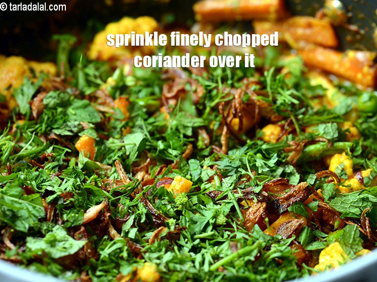 Step 32 – Sprinkle finely <a href="https://www.tarladalal.com/glossary-chopped-coriander-783i">chopped coriander (dhania)</a> over the vegetables layer.