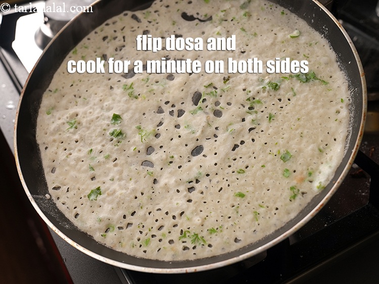 Step 33 – Flip the dosa and cook on medium flame for a minute on both the sides …