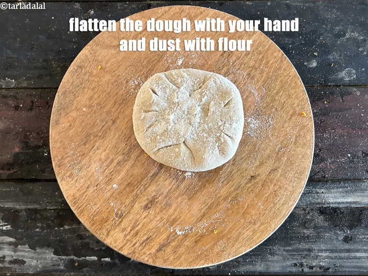 Step 37 – Flatten the dough with your hand and dust wth flour.