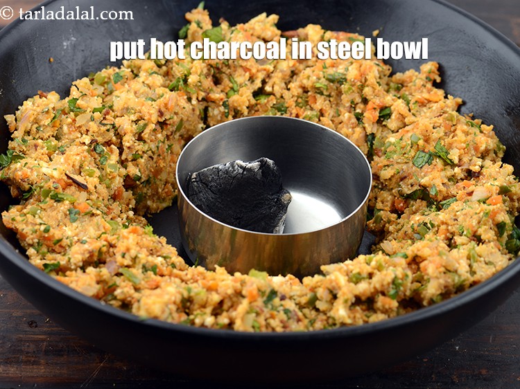 Step 32 – Put the hot charcoal in the steel bowl.