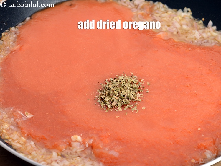 Step 34 – Add &frac12; tsp&nbsp;<a href="https://www.tarladalal.com/glossary-dried-oregano-268i">dried oregano</a>.