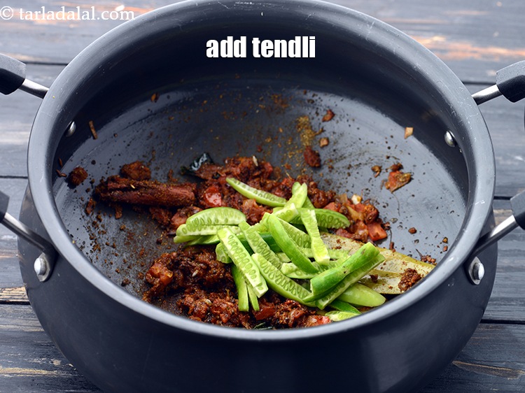 Step 33 – Add 1/4 cup&nbsp;<a href="https://www.tarladalal.com/glossary-sliced-tendli-1161i">sliced tendli (ivy gourd)</a>.&nbsp;