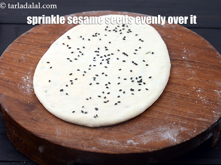 Step 34 – Sprinkle &frac14; tsp <a href="https://www.tarladalal.com/glossary-black-sesame-seeds-kala-til-kale-til-862i">black sesame seeds (kala til)</a> evenly over it.