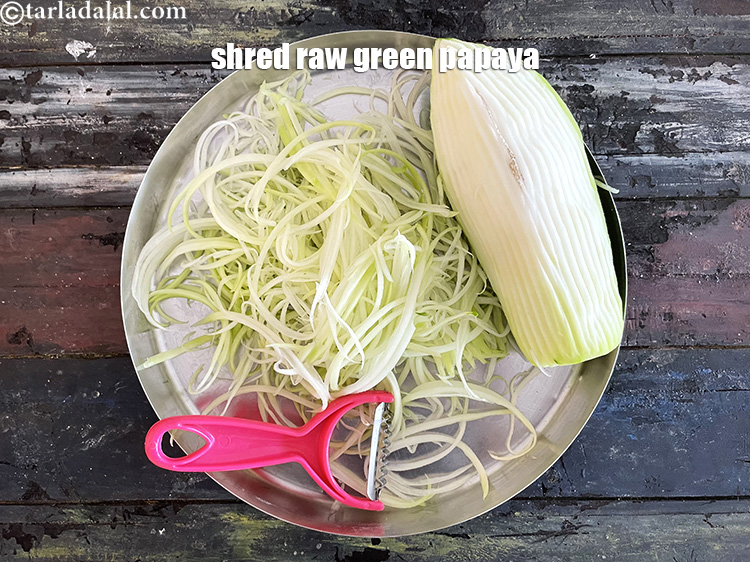 Step 5 – <meta charset="UTF-8" />Shred the papaya into short&nbsp;thin strips (&nbsp;juliennes) using a juliennes peeler. We don't …