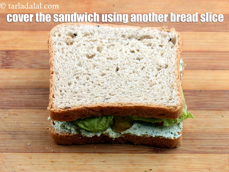 Step 32 – Cover the sandwich using another <a href="https://www.tarladalal.com/glossary-whole-wheat-bread-gehun-ka-bread-855i">whole wheat bread slice</a>&nbsp;or multigrain bread slice.