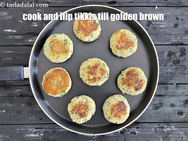Step 33 – Cook and flip tikkis till golden brown.&nbsp;