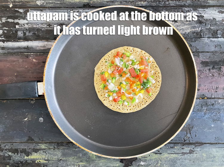 Step 36 – The uttapam is cooked at the bottom.