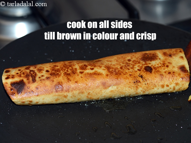 Step 33 – Cook on all sides (even sides) till brown in colour and crisp using two flat …