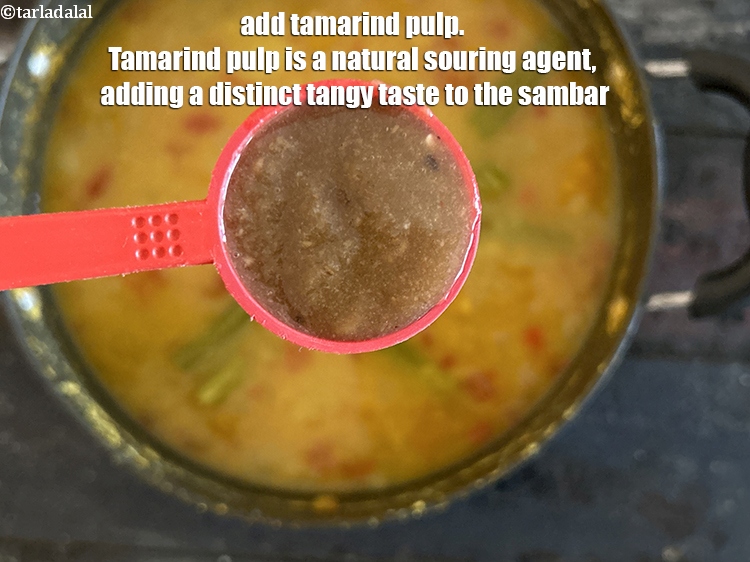 Step 34 – <html><head></head><body><p>Add&nbsp;1 tbsp&nbsp;<a href="glossary-tamarind-pulp-tamarind-extract-imli-ka-pulp-838i">tamarind (imli) pulp</a>.&nbsp;Tamarind pulp is a natural souring agent, adding a distinct tangy …