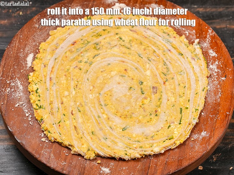Step 33 – Roll it into a 150 mm. (6 inch) diameter thick paratha using wheat flour for …