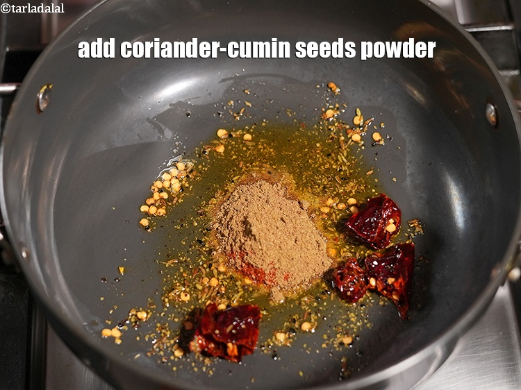 Step 33 – Add 1 tsp <a href="https://www.tarladalal.com/glossary-coriander-cumin-seeds-powder-dhania-jeera-powder-375i">coriander-cumin seeds (dhania-jeera) powder</a>.