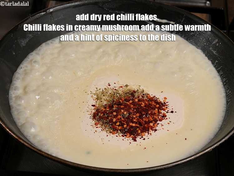 Step 34 – Add 1 tsp <a href="https://www.tarladalal.com/glossary-dry-red-chilli-flakes-paprika-338i">dry red chilli flakes (paprika)</a>. Chilli flakes in creamy mushroom add …
