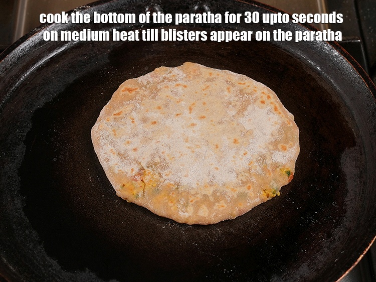 Step 41 – <meta charset="UTF-8" /> Cook the bottom of the roti for 30 upto seconds on medium …