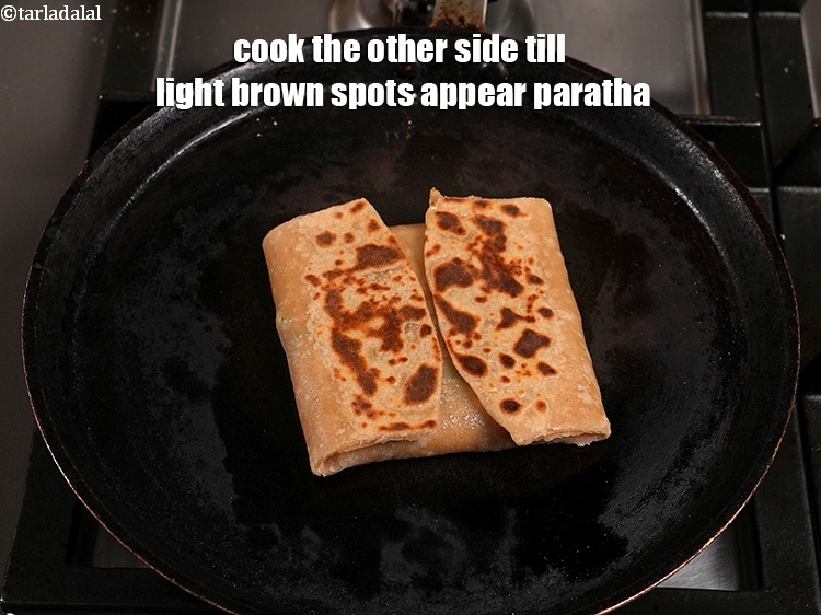 Step 53 – <meta charset="UTF-8" /> Cook all 4 sides of the paratha on a slow flame using …