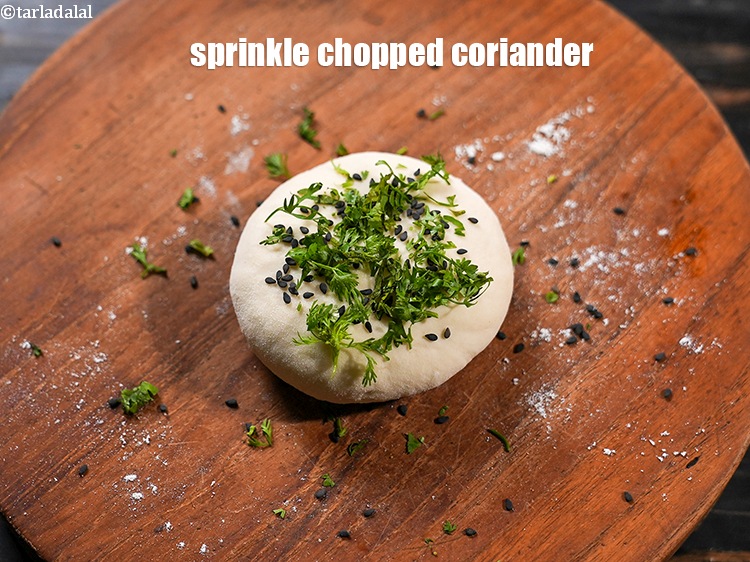 Step 34 – Sprinkle 1 tsp <a href="https://www.tarladalal.com/glossary-chopped-coriander-783i">chopped coriander (dhania)</a>.