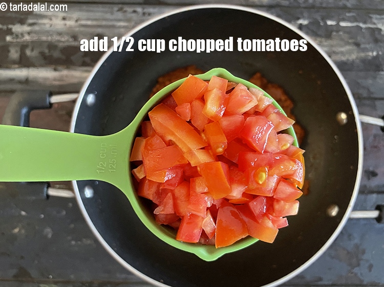 Step 33 – <html><head></head><body><p>Add&nbsp;1/2 cup&nbsp;finely&nbsp;<a href="glossary-chopped-tomatoes-779i">chopped tomatoes</a>.</p></body></html>