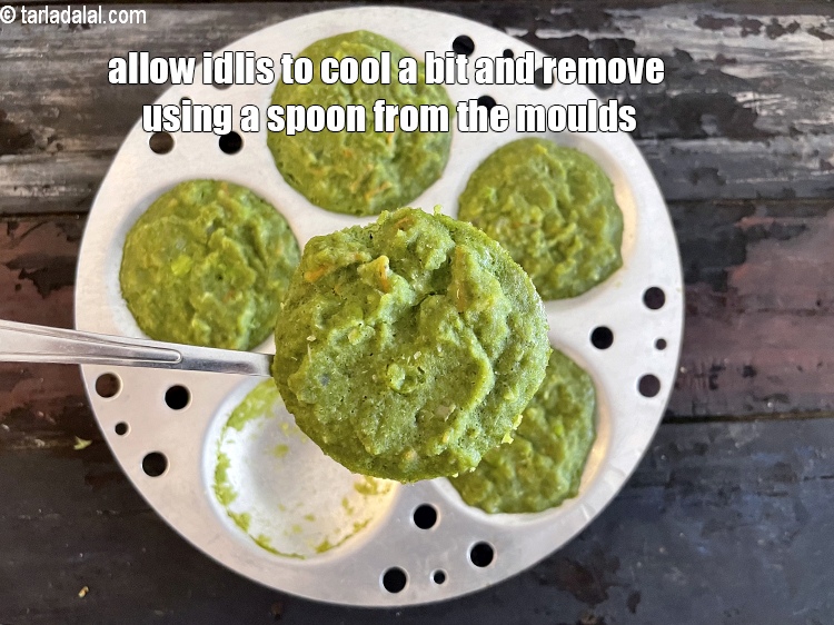 Step 33 – <meta charset="UTF-8" />Allow the idli to cool a bit and then remove from molds using …