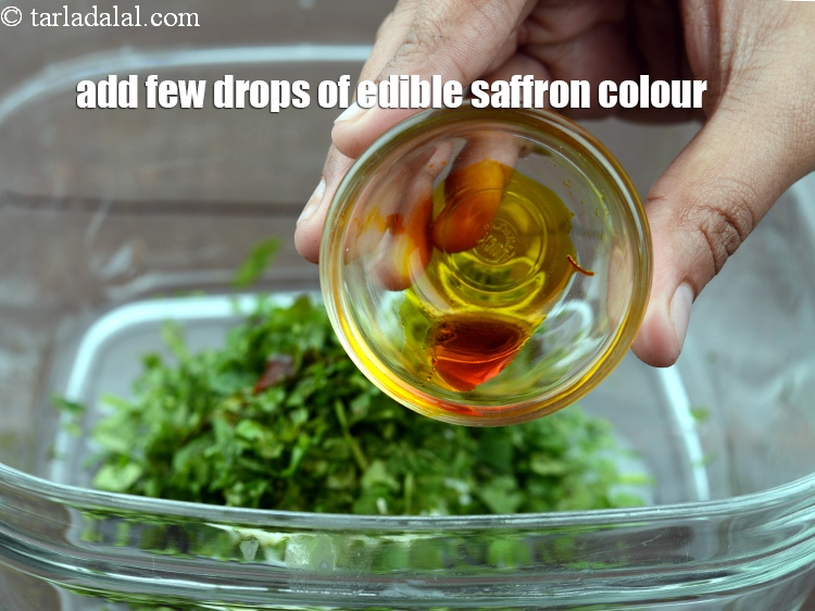 Step 38 – Add a few drops of edible <a href="https://www.tarladalal.com/glossary-saffron-colour-kesar-ka-rang-368i">saffron colour</a>.