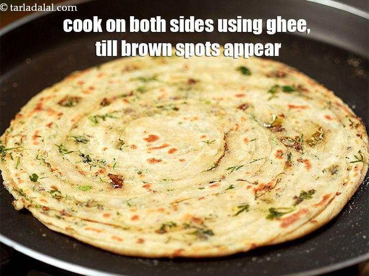 Step 33 – Cook each paratha on both the sides, using &frac12; tbsp ghee, till brown spots appear …