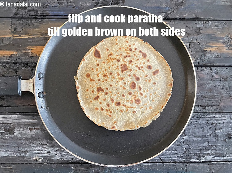 Step 34 – <meta charset="UTF-8" /> Flip and cook till golden brown on both sides.&nbsp;Your paratha is ready.&nbsp;