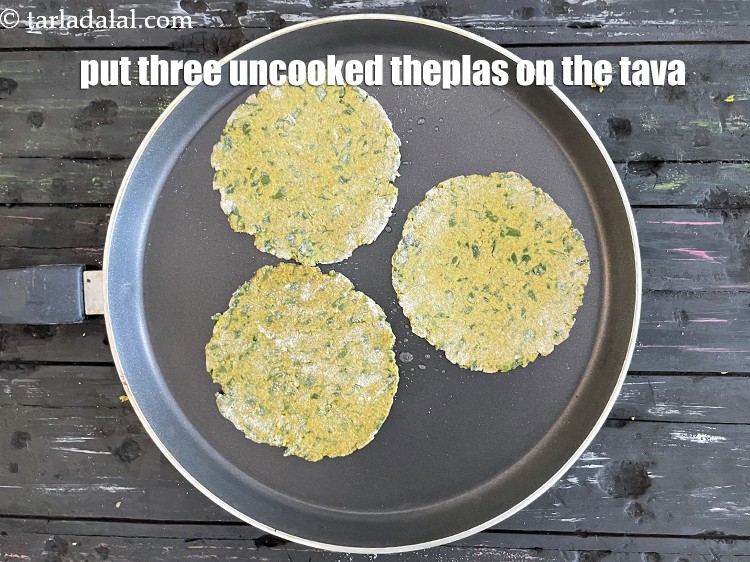 Step 41 – Put three uncooked theplas on the tava. Since they are mini theplas we are cooking …