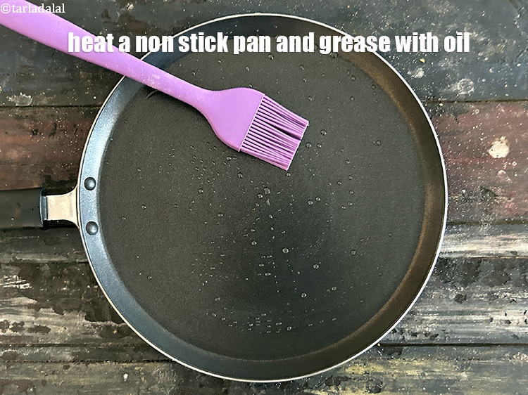 Step 40 – Heat a non-stick tava (griddle) and grease it with oil.