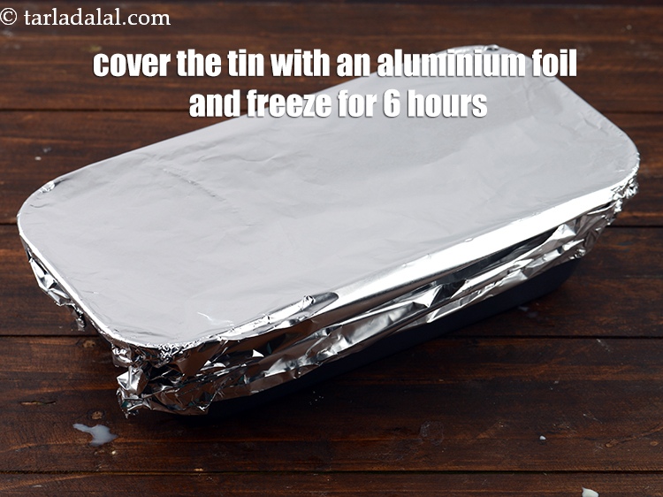 Step 33 – Cover the tin with an aluminium foil and freeze for 6 hours or till semi-set.