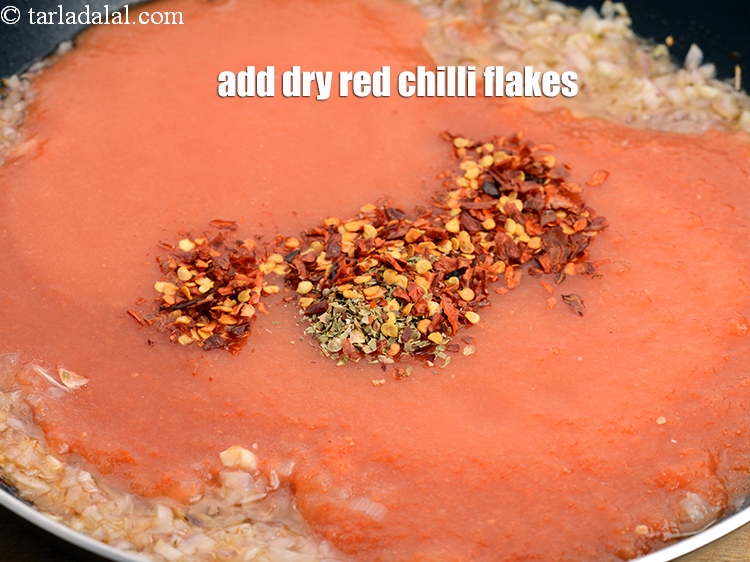 Step 35 – Add 1 tsp <a href="https://www.tarladalal.com/glossary-dry-red-chilli-flakes-paprika-338i">dry red chilli flakes (paprika)</a>.