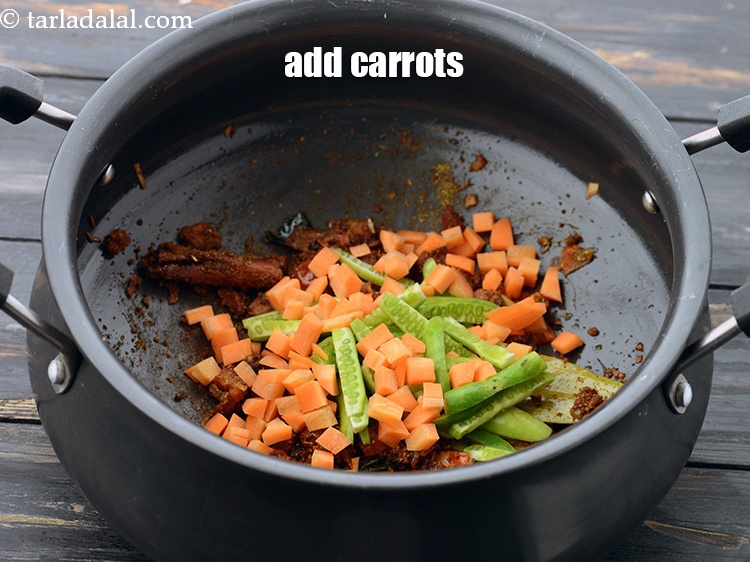 Step 34 – Add 1/4 cup&nbsp;<a href="https://www.tarladalal.com/glossary-chopped-carrot-798i">chopped carrot</a>.&nbsp;