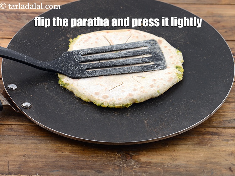 Step 34 – Flip the&nbsp;paratha, press it lightly on the edges and cook the paratha slightly on&nbsp;other side …