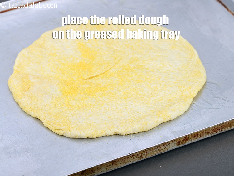Step 33 – Place the rolled dough on the greased baking tray.
