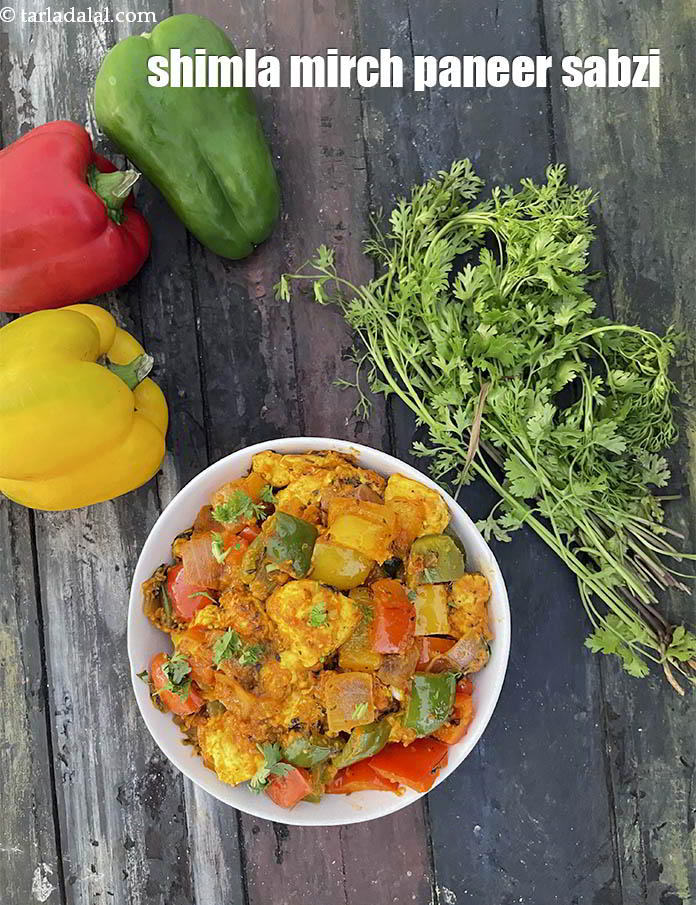 Step 33 – Serve the&nbsp;paneer capsicum sabzi&nbsp;hot garnished with a sprig of coriander.