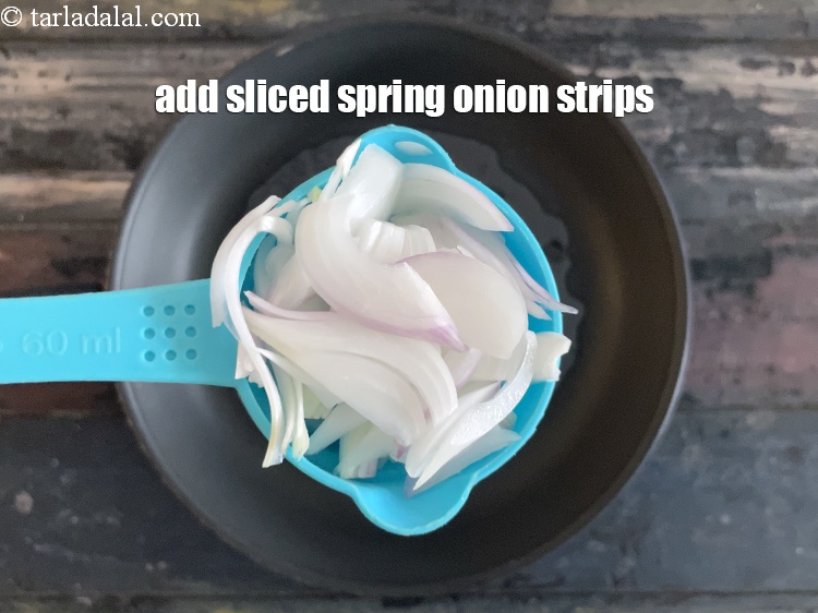 Step 35 – Add&nbsp;<meta charset="UTF-8" />1/2 cup&nbsp;<a href="glossary-sliced-spring-onions-1576i">sliced spring onions</a>&nbsp;strips.