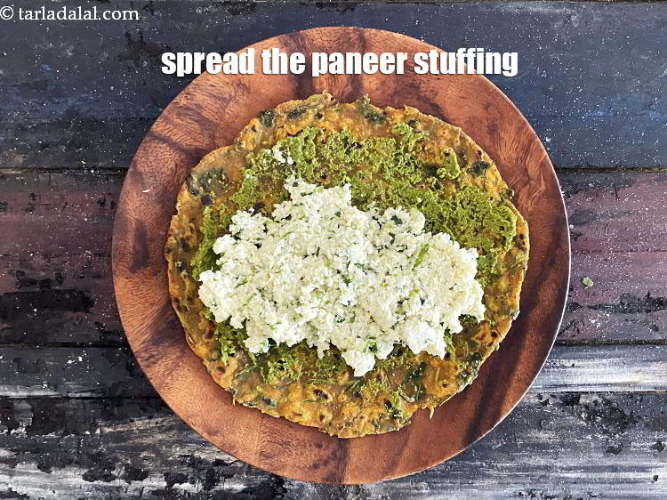 Step 33 – Spread the stuffing around the paratha.