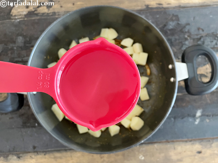 स्टेप 46 – १/४ कप गरम पानी डालें।