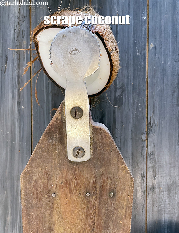 Step 7 – Scrape it using the traditional scrapper (carefully scrape the white part of the coconut avoiding …
