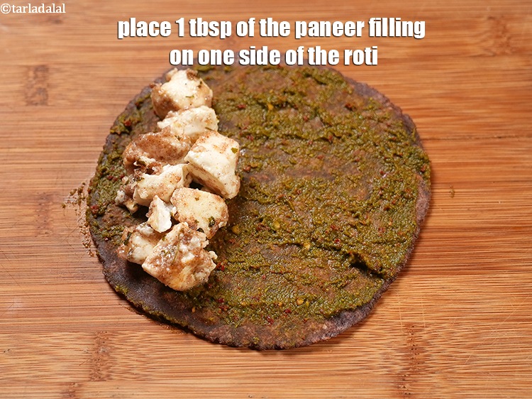 Step 32 – Place 1 tbsp of the paneer filling on&nbsp;one side of the roti.