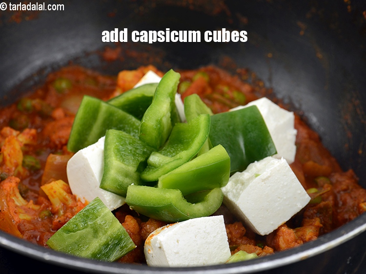 Step 35 – Add &frac12; cup&nbsp;<a href="https://www.tarladalal.com/glossary-capsicum-cubes-170i">capsicum cubes</a>.