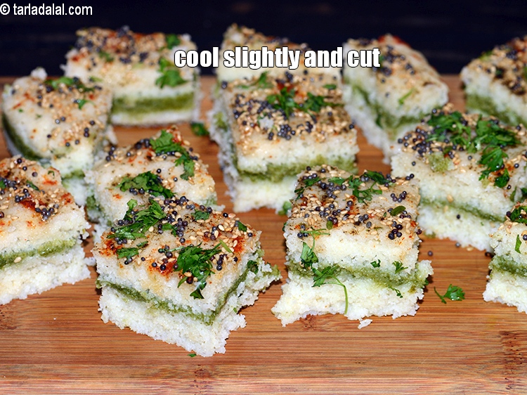 Step 35 – Cool the rava dhokla slightly and cut into equal sized 15 squares pieces.