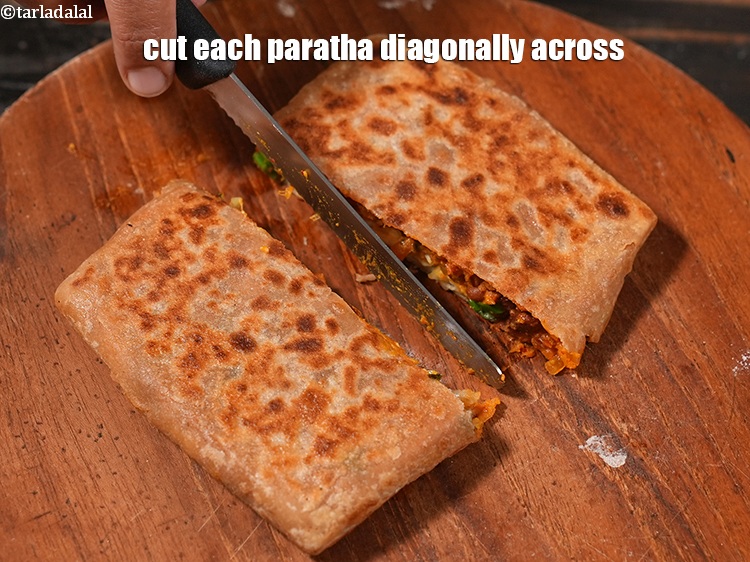 Step 54 – <meta charset="UTF-8" /> Cook the other&nbsp;side till light brown spots appear on the<strong>&nbsp;rajma vegetable paratha</strong>. …