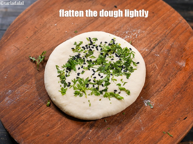 Step 35 – Flatten the dough lightly so the seeds stick to the dough.