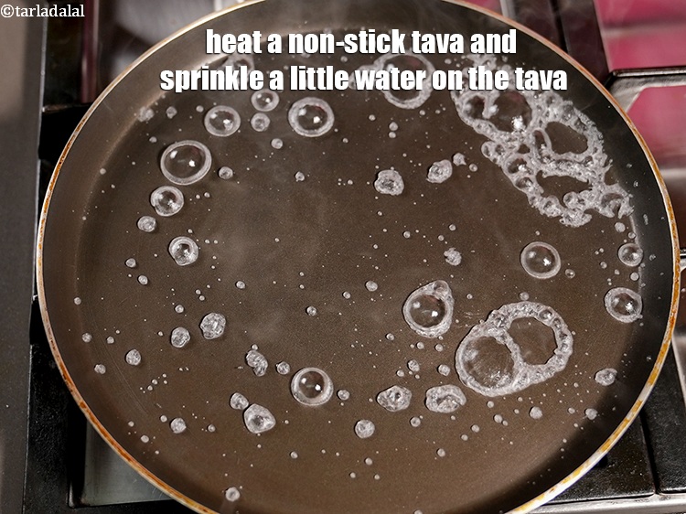 Step 34 – Heat a non-stick tava (griddle) and sprinkle a little water on the tava (griddle).